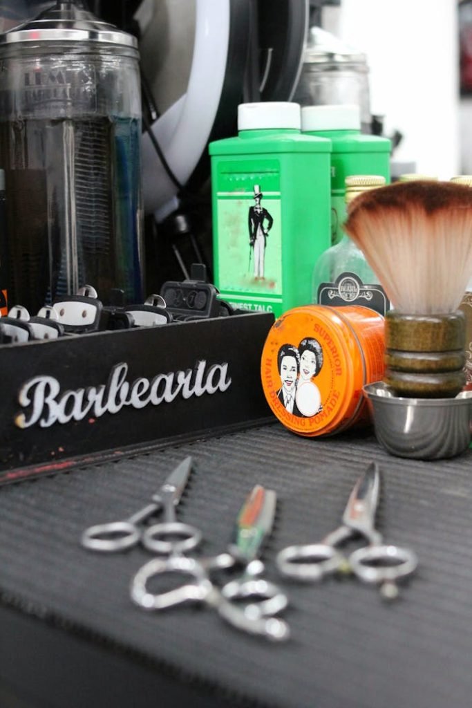 Vintage barber shop tools including clippers, scissors, and grooming products in São Paulo.